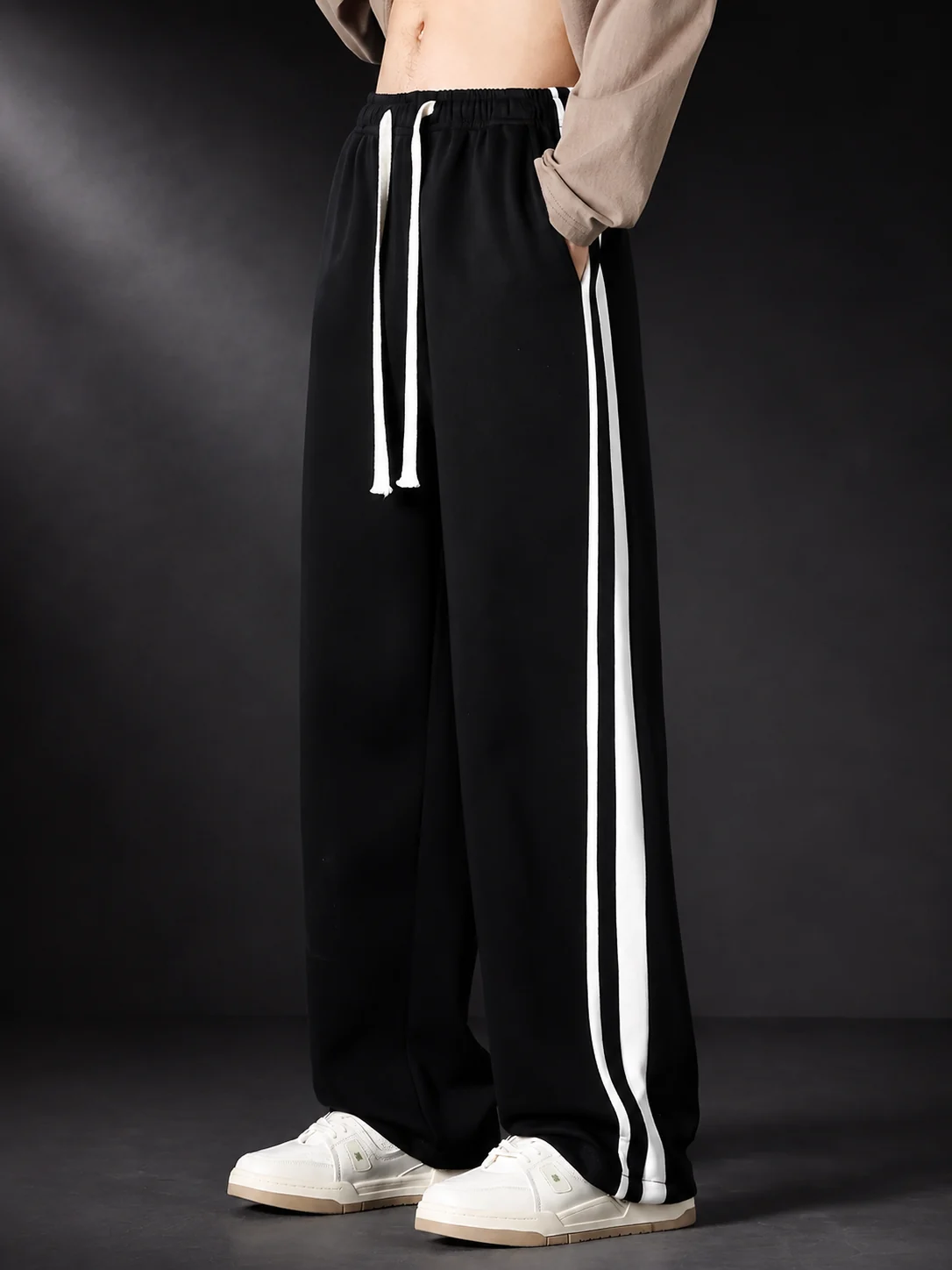 Black double stripe trackpant detail view
